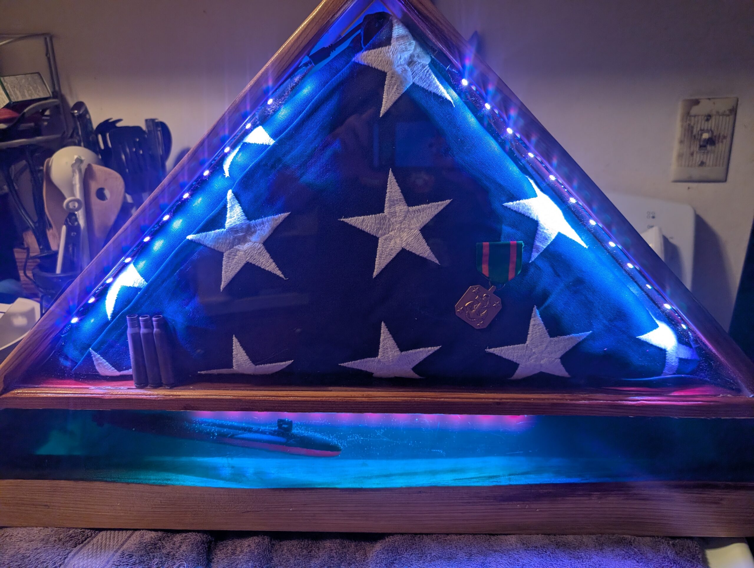 A flag display with an epoxy underwater scene as the base, with a submarine in it.
